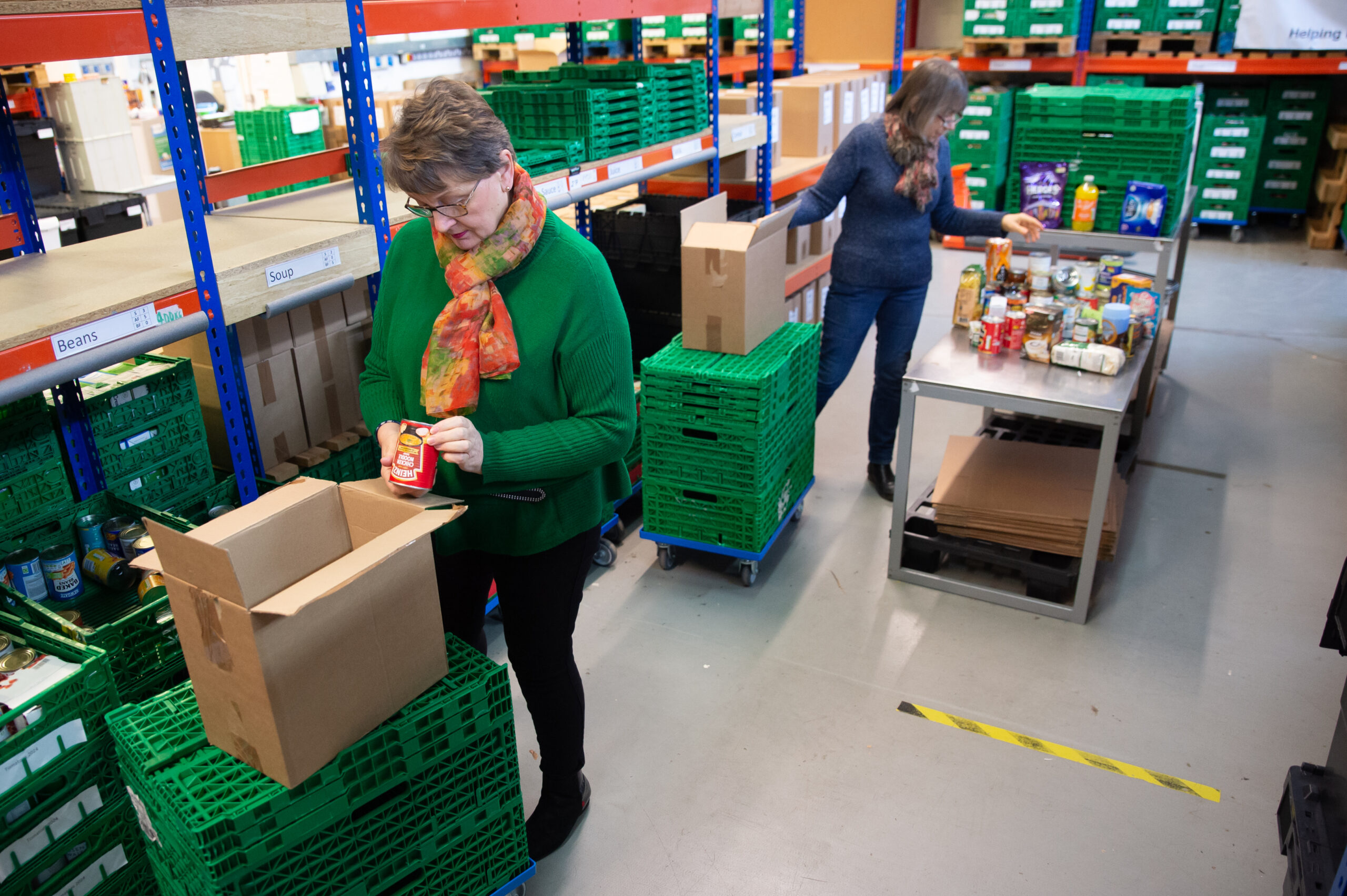 volunteers preparing emergency food parcel